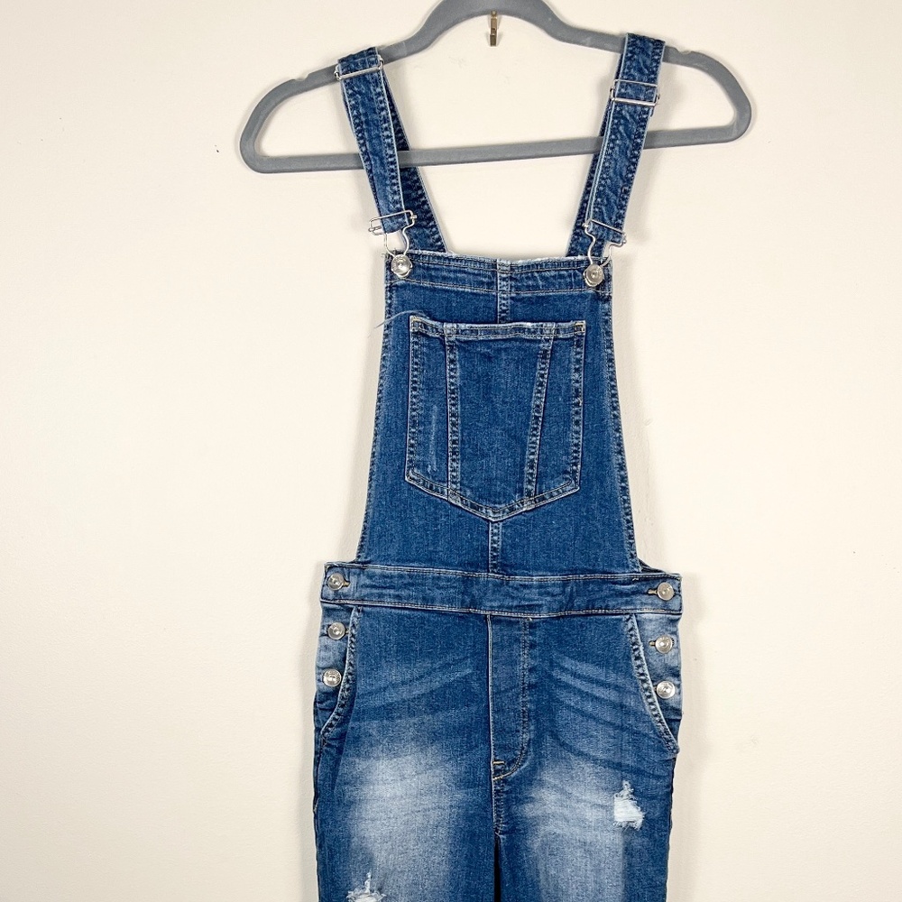 Distressed denim overalls from H&M